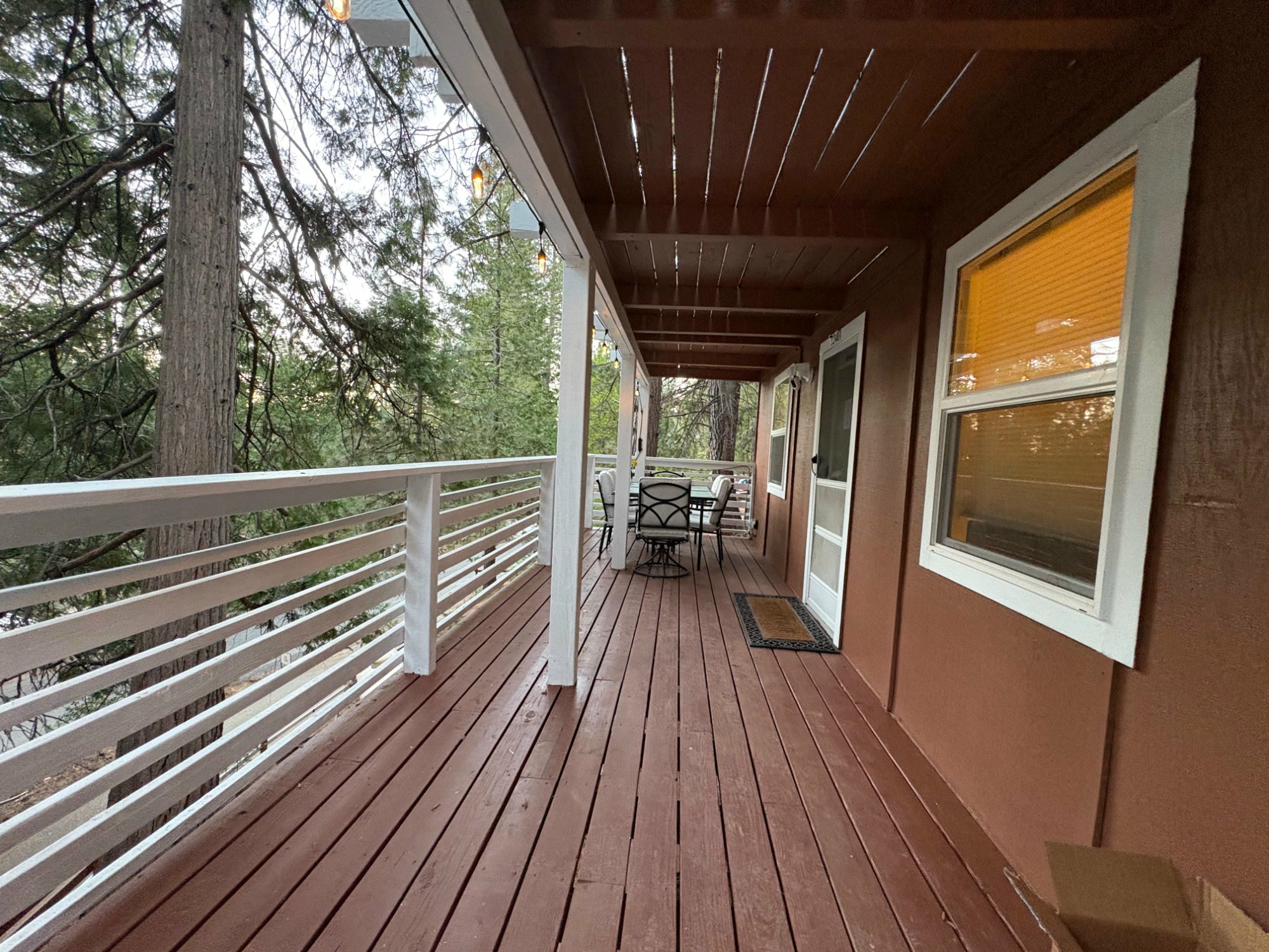 Half Dome Haven wraparound deck with outdoor seating