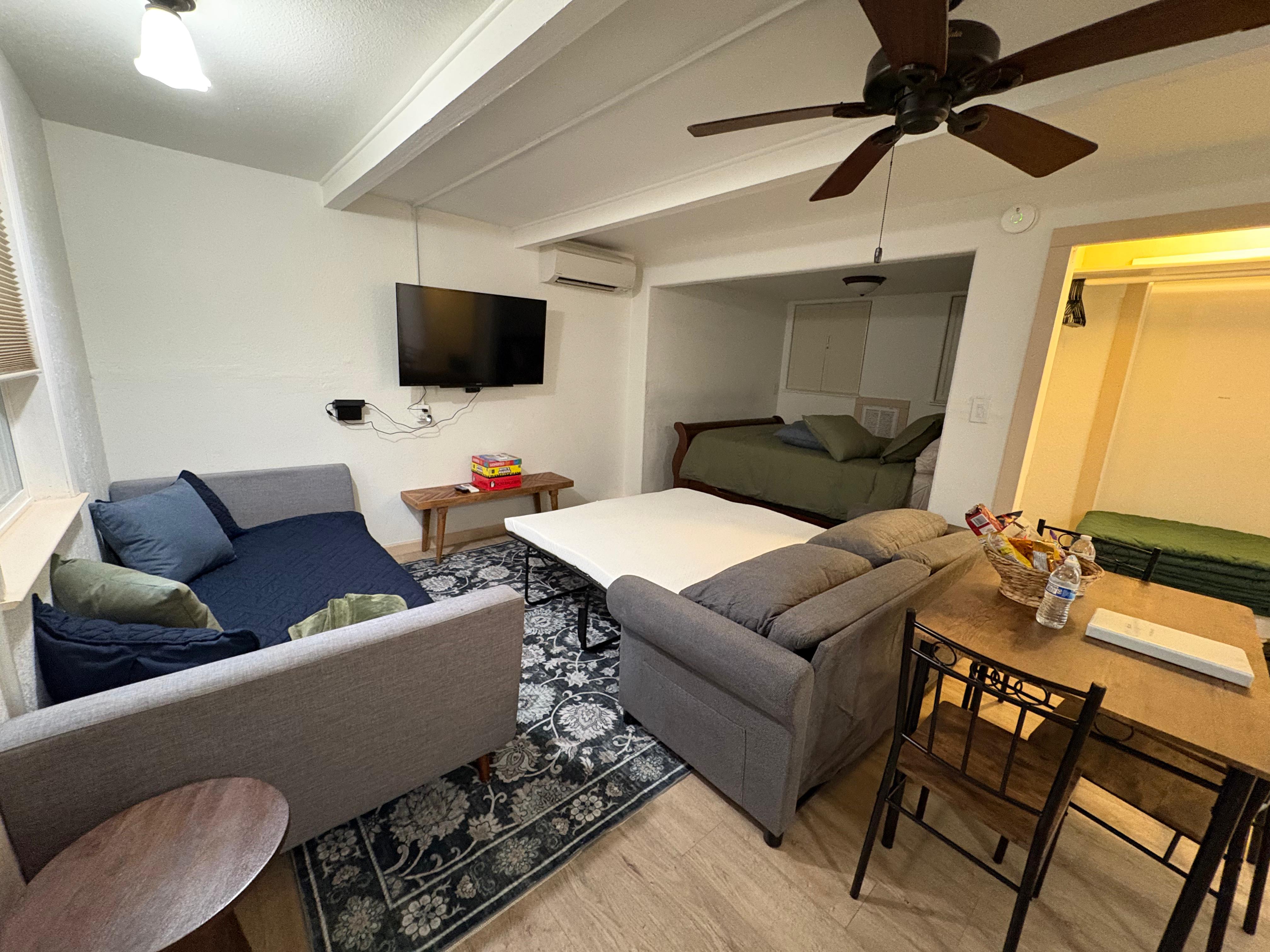 Half Dome Haven living area with sofas, coffee table, and wall TV